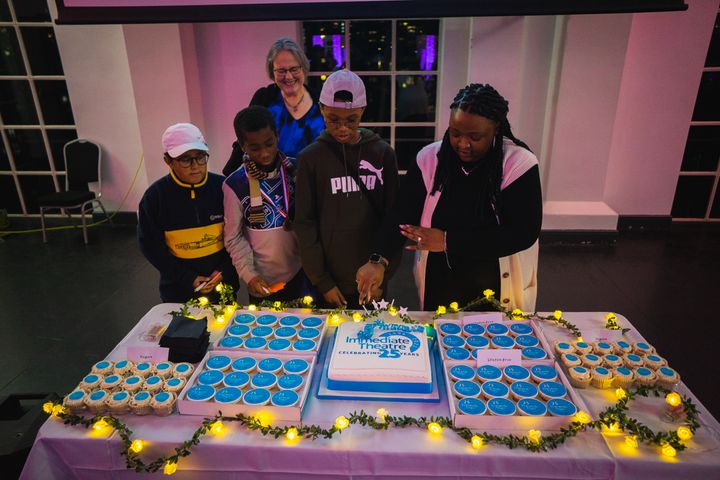 Artistic Director Jo Carter, Chair of Trustees Shekeila Scarlett and Youth Theatre participants cut the cake at Immediate Theatre’s 25th Anniversary party at the West Reservoir, 30th October 2021 (Credit Vince Abayomi Dubre)