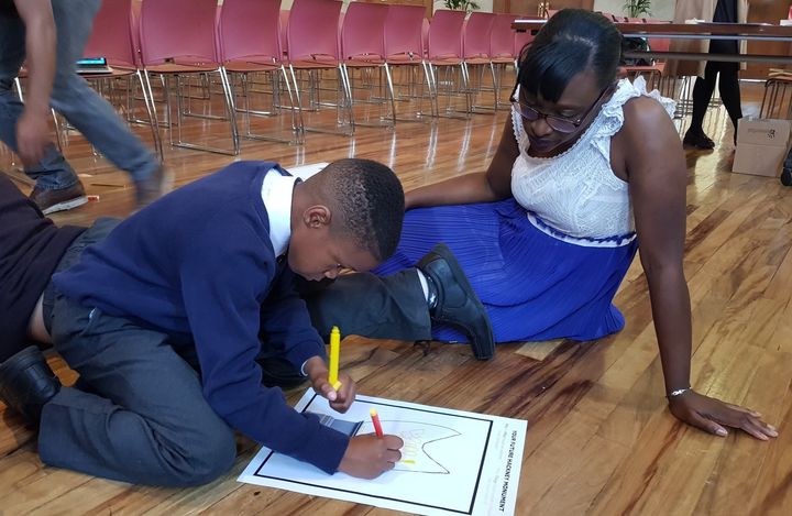 Image: Cllr Bramble with a school student (Source: Hackney Council)